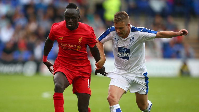 BIRKENHEAD, ENGLAND - JULY 08: Sadio Mane of Liverpool gets past Jay Harris of Tranmere Rovers during the Pre-Season Friendly match between Tranmere Rovers