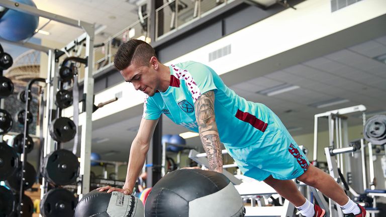 Manuel Lanzini works on his upper body strength as West Ham return to pre-season training