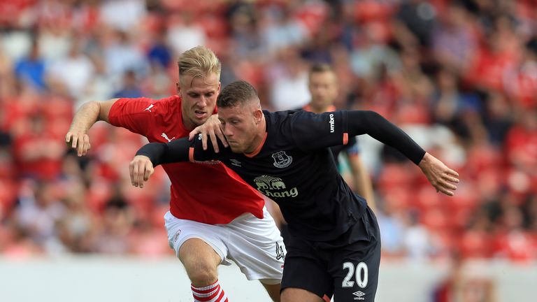 Marc Roberts (L) of Barnsley and Ross Barkley of Everton battle for the ball during the pre-season friendly at Oakwell