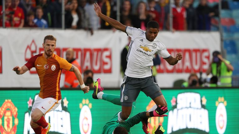 Galatasaray trips up Marcus Rashford of Manchester United to give away a penalty.