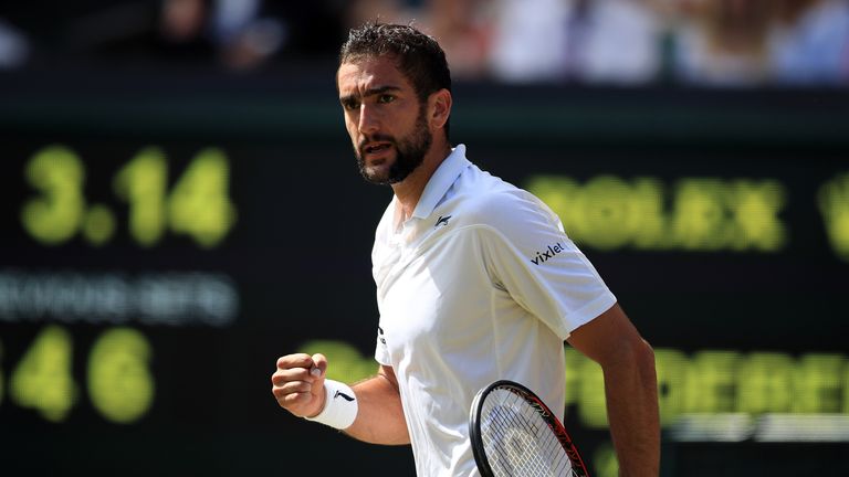 Marin Cilic reacts during his match against Roger Federer on day nine of the Wimbledon Championships at the All England Lawn Tennis and Croquet Club, Wimbl