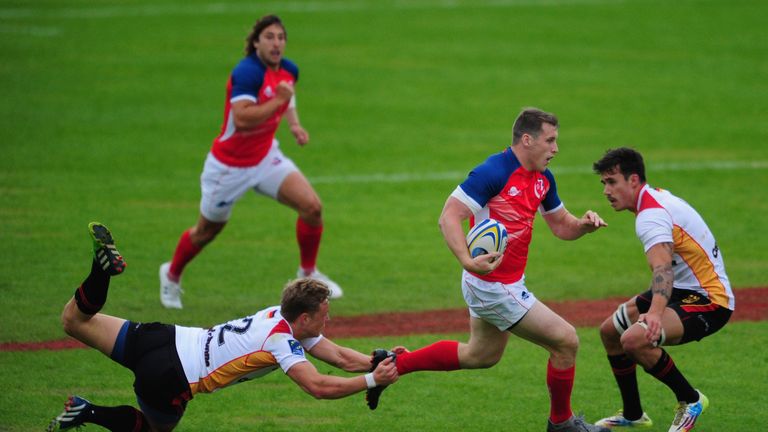 Mark Bennett of Great Britain Lions is tackled by Robert Haase of Germany 