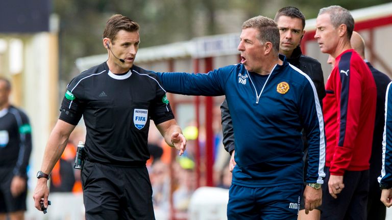 Motherwell manager Mark McGhee speaks with referee Steven McLean