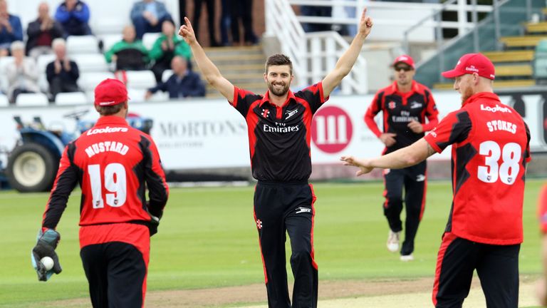 Mark Wood of Durham celebrates the wicket of Adam Rossington 