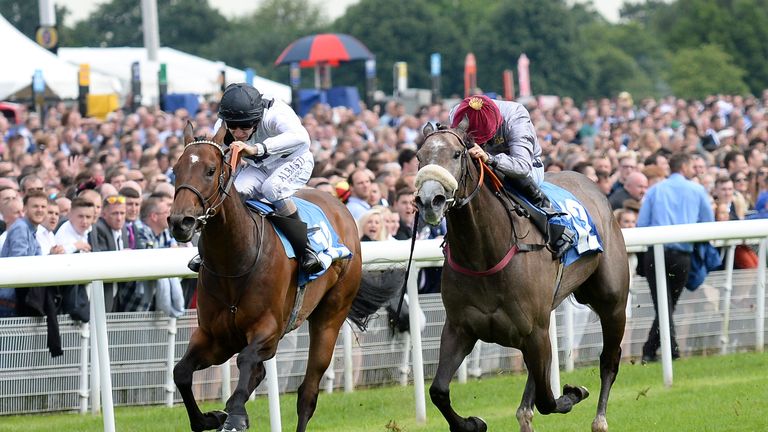 Marsha ridden by Luke Morris (left) beats Easton Angel ridden by Paul Mulrennan to win the John Smith's City Wall Stakes during the John Smith's Cup Meetin
