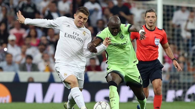 Real Madrid's Croatian midfielder Mateo Kovacic (L) vies with Manchester City's French defender Gael Clichy during the UEFA Champions League semi-final sec