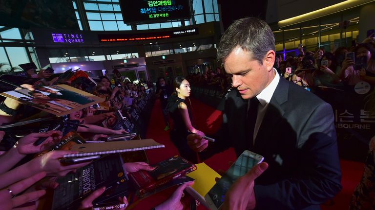 Matt Damon signs autographs for fans during on the red carpet  in Seoul 