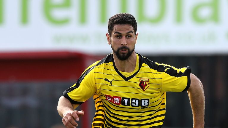 WOKING, ENGLAND - JULY 10:  Miguel Britos of Watford runs with the ball during the pre season friendly match between Woking and Watford at The Laithwaite C