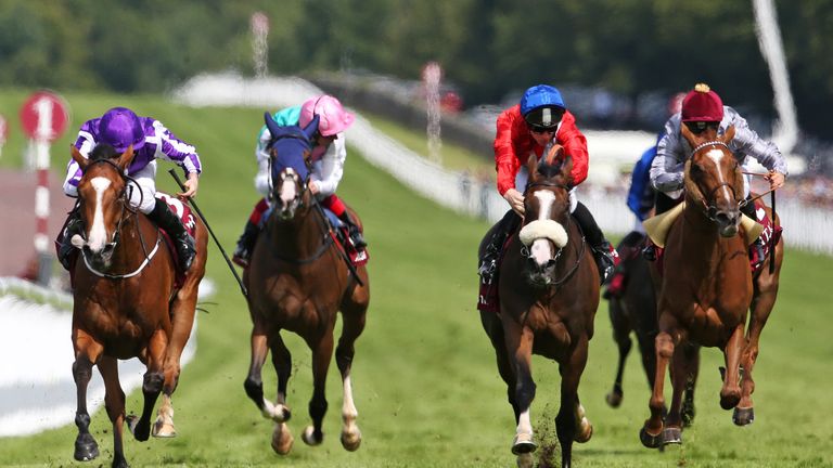 Ryan Moore riding Minding (L) win the Qatar Nassau Stakes at Goodwood on July 30, 2016.