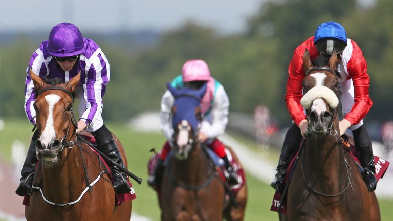 Ryan Moore and Minding win the Nassau Stakes at Goodwood.