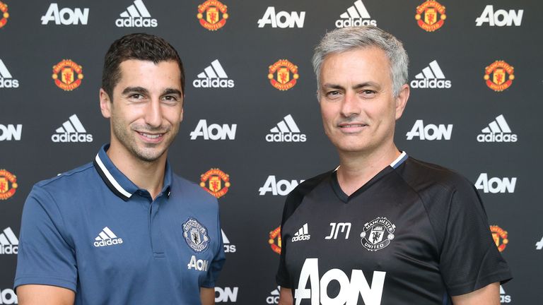 MANCHESTER, ENGLAND - JULY 06:  (EXCLUSIVE COVERAGE) Henrikh Mkhitaryan of Manchester United poses with Manager Jose Mourinho after signing for the club at