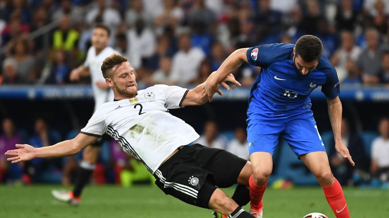 Germany's defender Shkodran Mustafi (L) vies for the ball with France's forward Andre-Pierre Gignac during the Euro 2016 semi-final football match between 