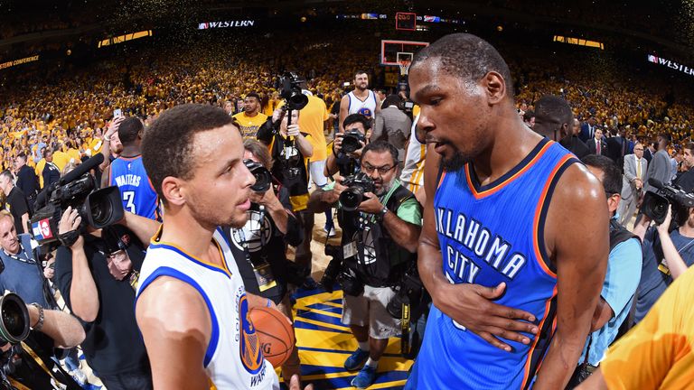 OAKLAND, CA - MAY 30:  Stephen Curry #30 of the Golden State Warriors talks to Kevin Durant #35 of the Oklahoma City Thunder after Game Seven of the Wester