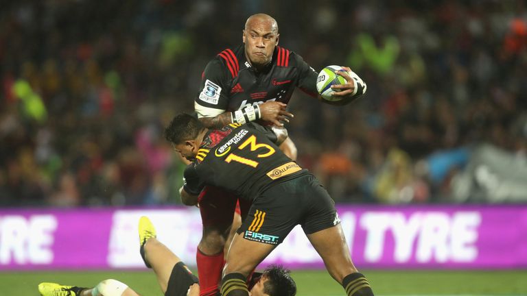 Nemani Nadolo of the Crusaders is tackled by Seta Tamanivalu of the Chiefs 