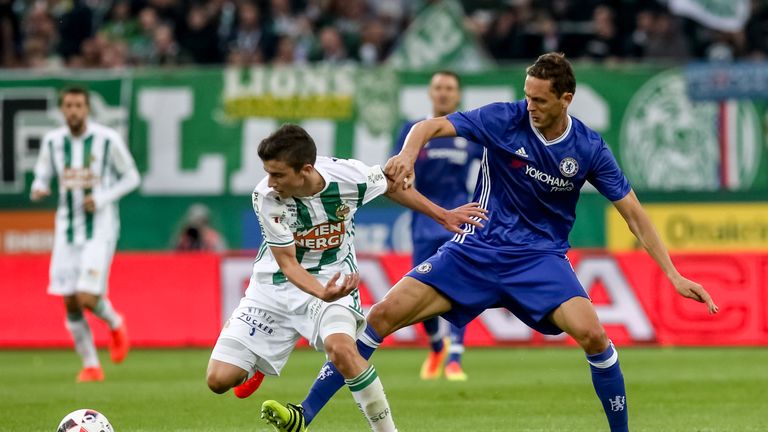 VIENNA, AUSTRIA - JULY 16:  Nemanja Matic (R) of Chelsea competes for the ball with Tamas Szanto (L) of Rapid Vienna during an friendly match between SK Ra