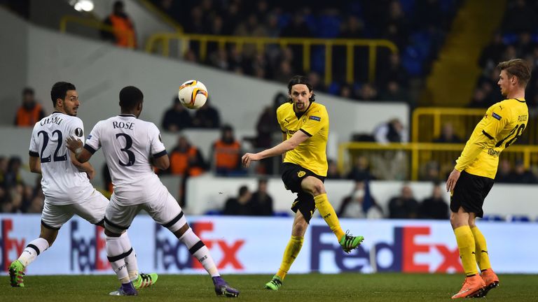 Borussia Dortmund's Serbian defender Neven Subotic (2nd  right) has a shot during the UEFA Europa League game with Tottenham
