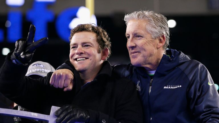 John Schneider celebrates with Pete Carroll after the Seattle Seahawks win in Super Bowl XLVIII against the Denver Broncos