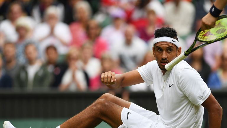 Nick Kyrgios takes a fall against Andy Murray at Wimbledon