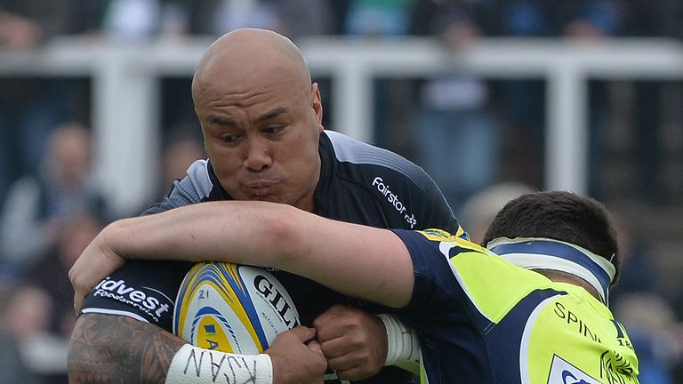 NEWCASTLE UPON TYNE, ENGLAND - MAY 07: Nili Latu of Newcastle Falcons is tackled by Cameron Neild of Sale Sharks during the Aviva Premiership match between