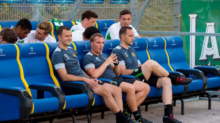 Celtic boss Brendan Rodgers (centre) with assistant Chris Davies (left) and John Kennedy