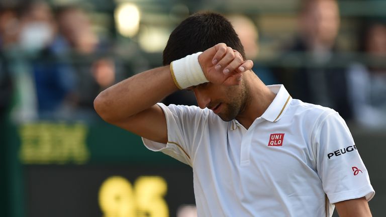 Serbia's Novak Djokovic reacts while playing US player Sam Querrey during their men's singles third round match on the fifth day of the 2016 Wimbledon Cham