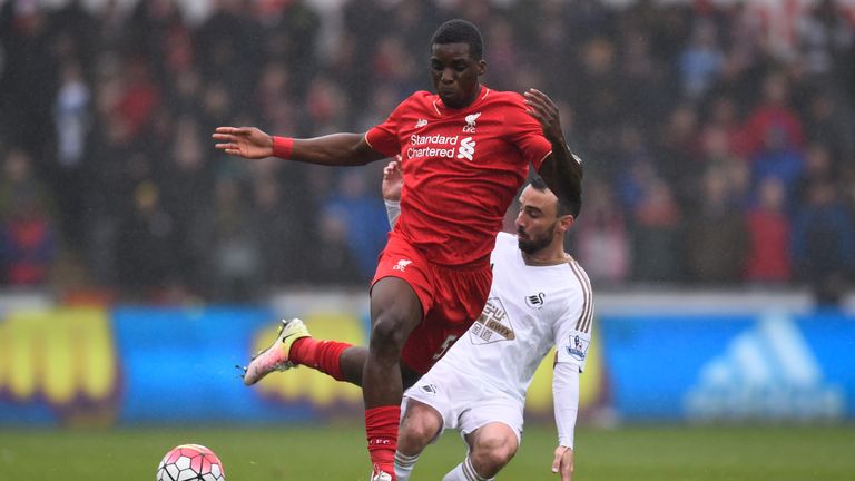 SWANSEA, WALES - MAY 01: Sheyi Ojo of Liverpool is tackled by Leon Britton of Swansea City during the Barclays Premier League match between Swansea City an