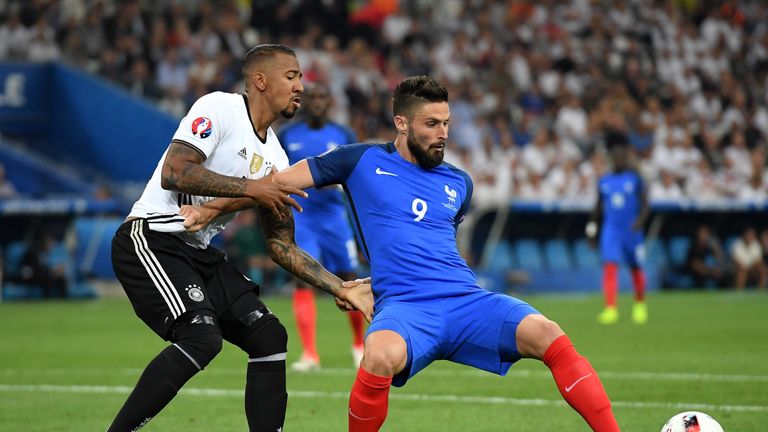 MARSEILLE, FRANCE - JULY 07: Olivier Giroud of France controls the ball under pressure of Jerome Boateng of Germany during the UEFA EURO semi final match b