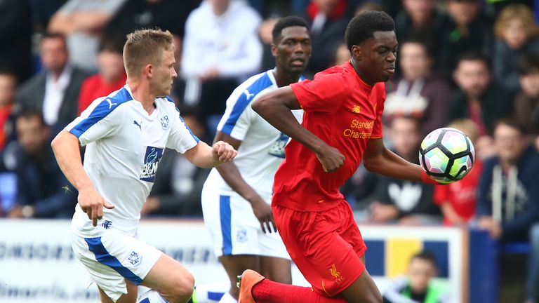 BIRKENHEAD, ENGLAND - JULY 08: Ovie Ejaria of Liverpool gets past Jay Harris of Tranmere Rovers during the Pre-Season Friendly match between Tranmere Rover