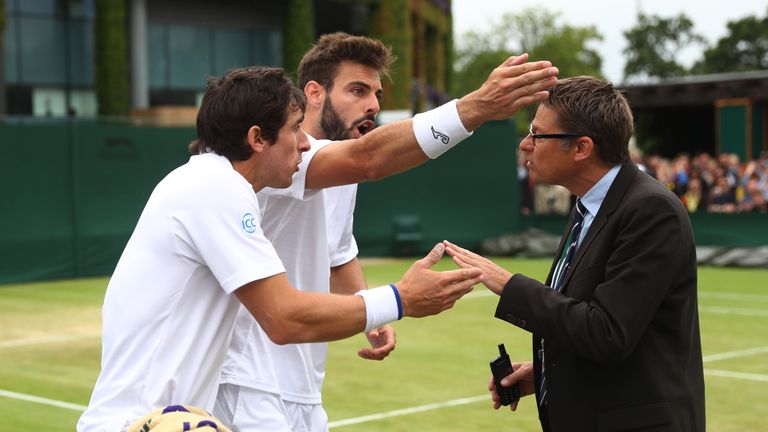 LONDON, ENGLAND - JULY 04:  Pablo Cuevas of Uraguay (L) and Marcel Granollers of Spain (R) argue with the match referee during the Men's Doubles third roun