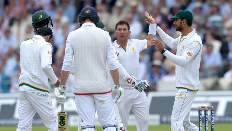 Pakistan's Yasir Shah (c) celebrates taking the wicket of James Vince