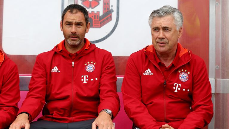Bayern Munich head coach Carlo Ancelotti (R) and assistant Paul Clement look on during a pre-season friendly