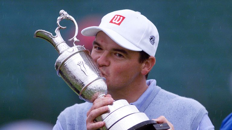 Scotland's Paul Lawrie kisses the trophy after winning the 1999 British Open Golf Championship at Carnoustie, Scotland, after a play-off with Justin Leonar