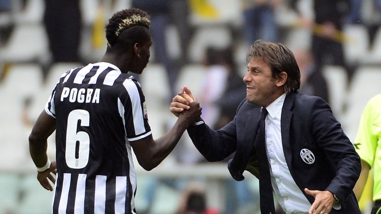 Juventus midfielder Paul Pogba (L) celebrates with coach Antonio Conte (R) after scoring during a Serie A football match against Torino