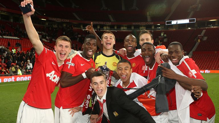 Pogba poses with Sean McGinty (left) and John Cofie (fourth right) 