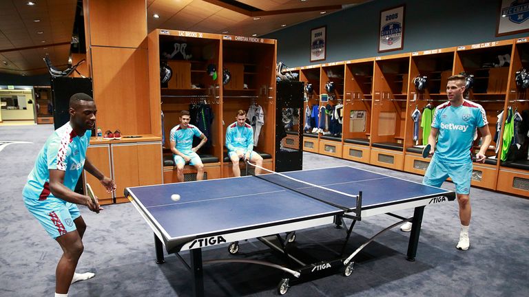 West Ham's Pedro Obiang and Adrian swap football for table tennis during a break from the training field
