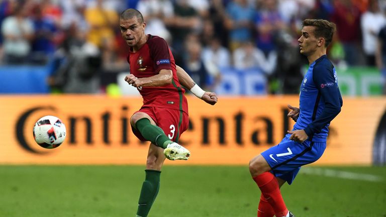 Portugal defender Pepe (L) kicks the ball past France forward Antoine Griezmann