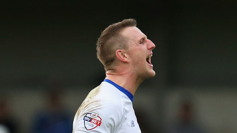ROCHDALE, ENGLAND - DECEMBER 06:  Peter Clarke of Bury celebrates after The Emirates FA Cup Second Round match between Rochdale and Bury at Spotland on Dec