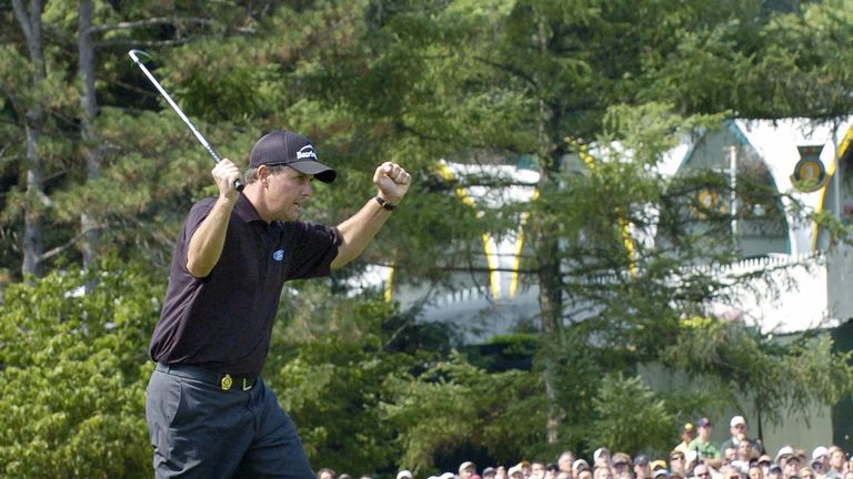 Springfield, UNITED STATES:  Phil Mickelson of the US celebrates his chip onto the 18th green during the final round of the PGA Championship at Baltusrol G