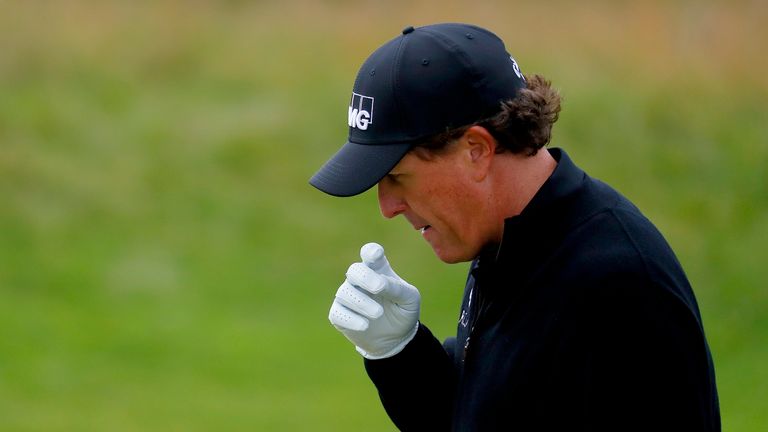 Phil Mickelson of the United States looks thoughtful as he walks on the 12th hole during the final round on day four of the 145th Open