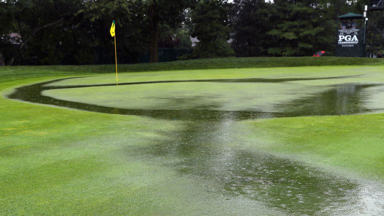 Water collects as it rains on the ninth green during the second round of the 2016 PGA Championship at Baltusrol
