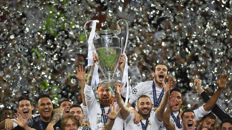 MILAN, ITALY - MAY 28:  Sergio Ramos of Real Madrid lifts the Champions League trophy after victory in the UEFA Champions League Final match between Real M