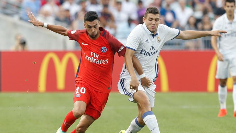 Paris Saint-Germain Javier Pastore (L) and Real Madrid midfielder Mateo Kovacic (R) chase a loose ball during an International Champions Cup soccer match i