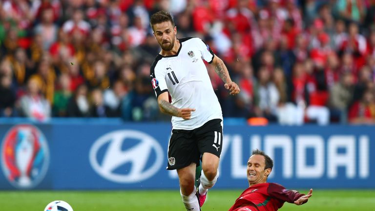 PARIS, FRANCE - JUNE 18:  Martin Harnik of Austria skips past Ricardo Carvalho of Portugal during the UEFA EURO 2016 Group F match between Portugal and Aus