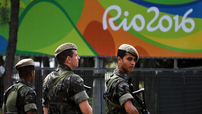 RIO DE JANEIRO, BRAZIL - JULY 31:  Soldiers stand guard outside the Olympic Athletes Village on July 31, 2016 in Rio de Janeiro, Brazil.  (Photo by David R