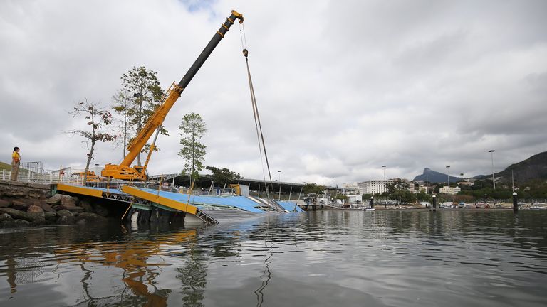 RIO DE JANEIRO, BRAZIL - JULY 31:  A ramp built for competitors' boats to reach the water hangs after collapsing at the Marina da Gloria sailing venue just