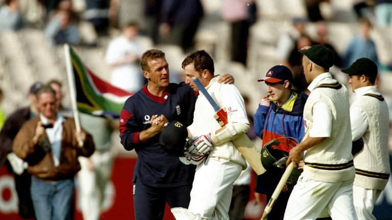 6 Jul 1998:  England Captain Alec Stewart congratulates team mate Robert Croft after the Third Test match against South Africa at Old Trafford in Mancheste