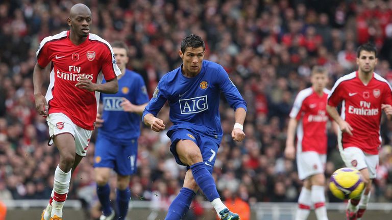 LONDON, ENGLAND - NOVEMBER 8: Cristiano Ronaldo of Manchester United clashes with Abou Diaby of Arsenal  during the Barclays Premier League match between