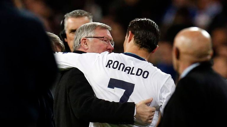 Manchester United's manager Sir Alex Ferguson speaks to Real Madrid's Cristiano Ronaldo after their Champions League soccer match at Santiago Bernabeu stadium in Madrid