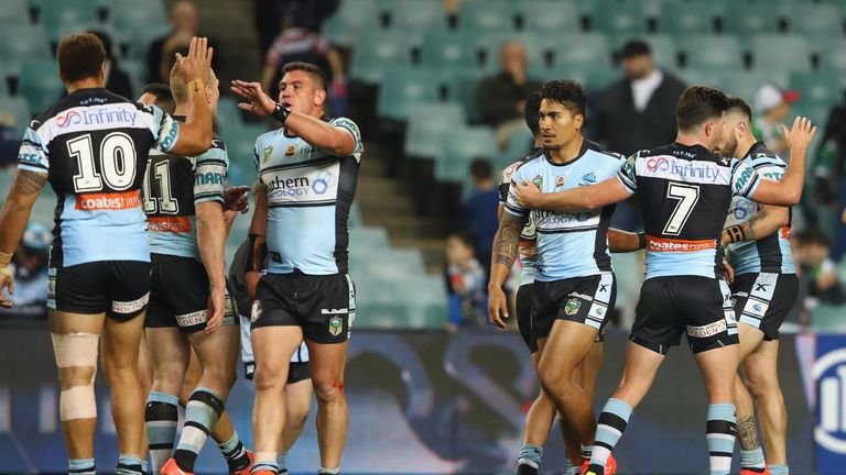 SYDNEY, AUSTRALIA - JULY 18:  Sosaia Feki of the Sharks celebrates with his team mates after scoring a try during the round 19 NRL match between the Sydney