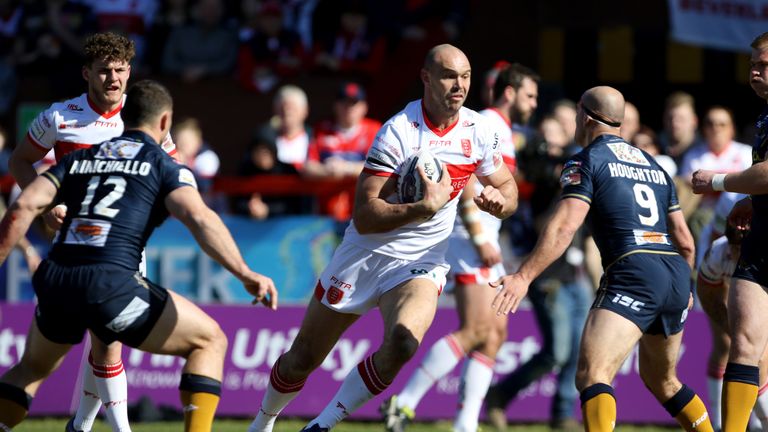 Dane Tilse runs at Hull FC's Danny Houghton during their Good Friday clash